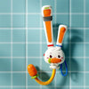 A white rabbit bath toy with an orange carrot attached, featuring an adjustable water sprinkler.
