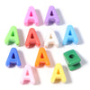 A collection of colorful acrylic letter A beads in various shades including pink, purple, green, red, white, blue, and yellow