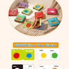 A set of nine colorful cloth books with various themes like sound, colour, nature, fruit, and traffic.