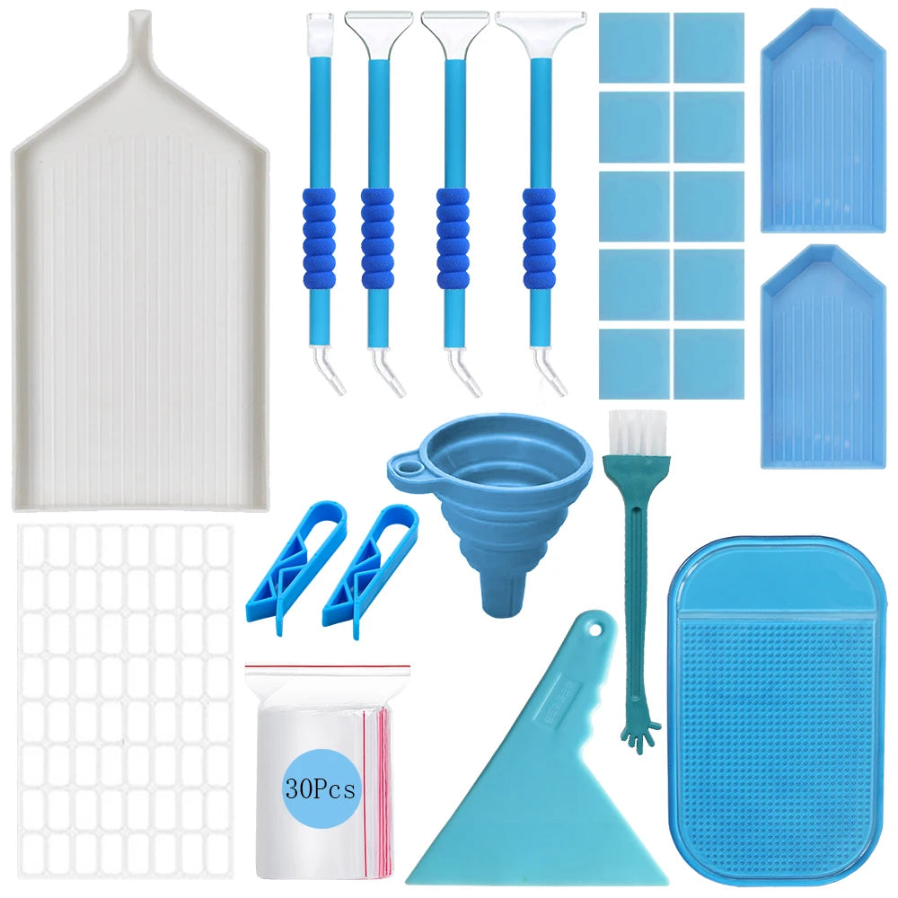 A complete diamond painting toolkit featuring various tools, jars, and a storage case in shades of white and blue.