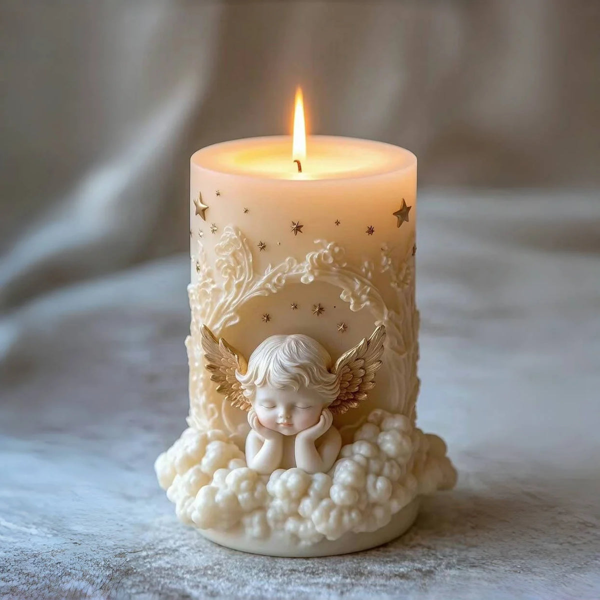 A white candle in a glass holder decorated with a detailed angel figure and gold stars.