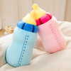 A set of soft cartoon boba milk bottle plush pillows in various pastel colors pink blue and yellow