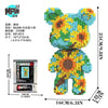 A colorful brick art bear figure made from building blocks with an accompanying box.