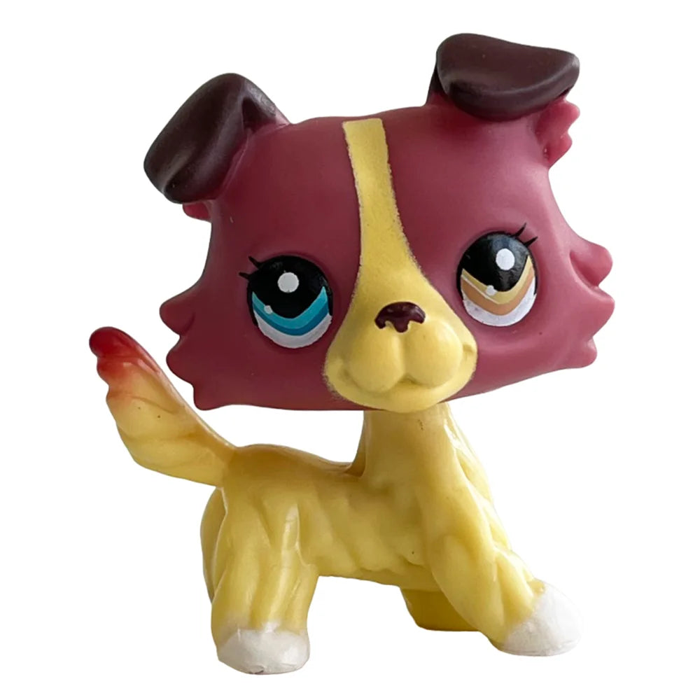 A small bobblehead toy of a deer with reddish-pink and yellow features.