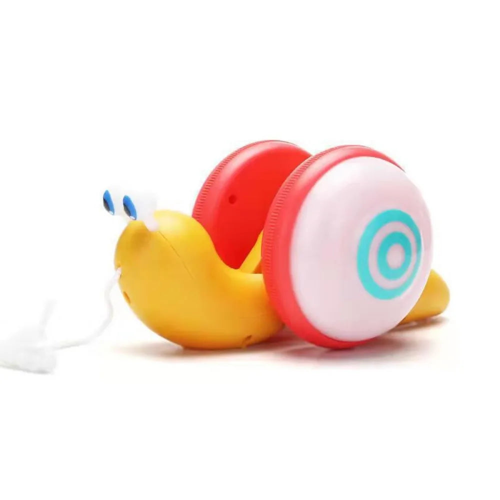 A yellow musical pull-along snail toy with a red and white circular component.