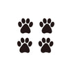 A set of four black dog paw print vinyl stickers.