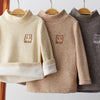 A beige long sleeve shirt for a child featuring a brown bear embroidery on the chest.