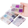 A hand holds a clear plastic box filled with various colored crushed glass stones for resin and craft projects.