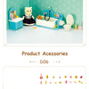 A miniature dollhouse bathroom set featuring a toilet, sink, and various accessories like brushes and toiletries.