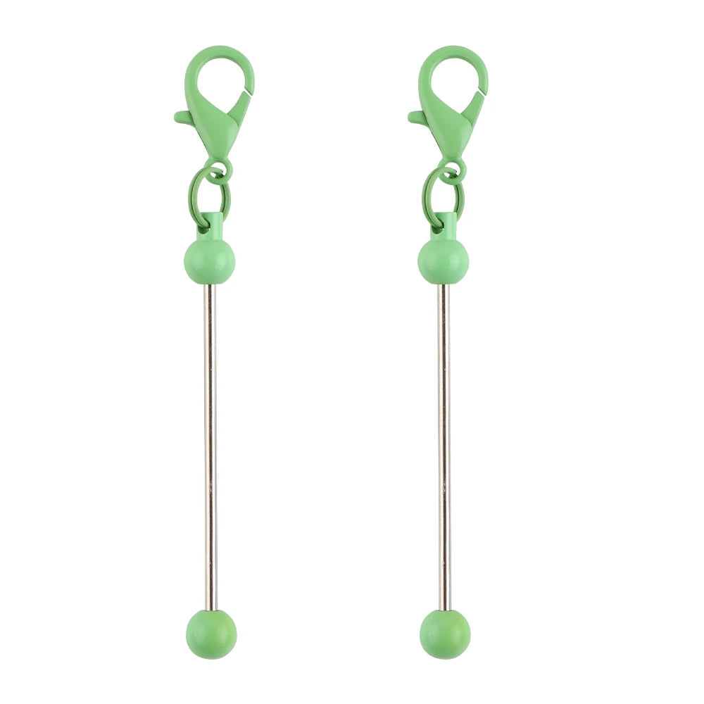A pair of metal keychain bars with lobster clasps for DIY jewelry making, colored light green.