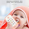 A baby is holding an orange silicone teether toy with various buttons and shapes, resting on a bright orange towel.