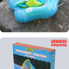 A blue inflatable baby seat ring with a yellow sunshade canopy is shown on a gray rock.