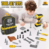 A child is using a yellow power tool set for creative play, surrounded by various tools and accessories.