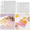Silicone molds for creating customizable tic-tac-toe game pieces in various colors and designs