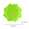 A bright lime green silicone splash flying ring toy with a central circular opening.