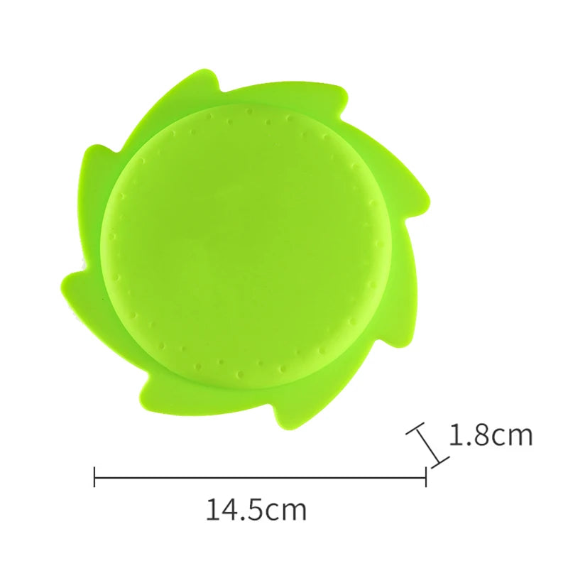 A bright lime green silicone splash flying ring toy with a central circular opening.