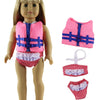 A doll wearing a pink and blue casual outfit set consisting of a vest, shorts, and a headband.