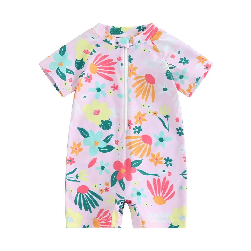 A pink baby rash guard swimsuit with a floral print featuring orange, green, and yellow flowers.
