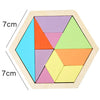 A wooden tangram puzzle board with six colored triangular pieces arranged in a hexagonal frame.