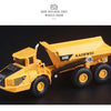 A yellow 1:87 scale diecast model of a Kaiwei A40D articulated dump truck.