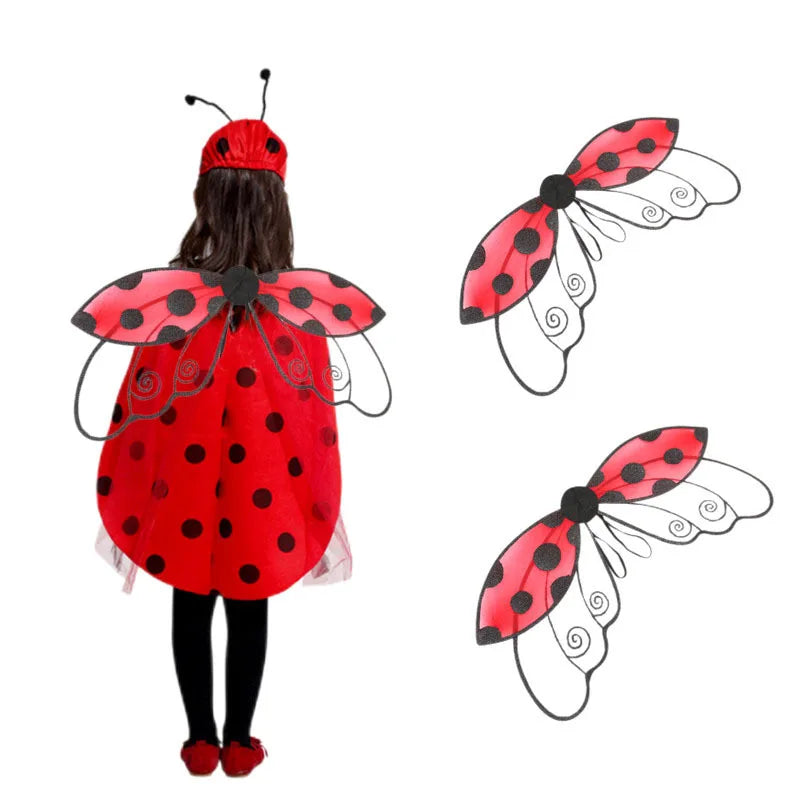Person wearing a red ladybug wings costume with black polka dots and a red cape.