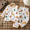 White long sleeve cotton pajama set for kids featuring happy animal prints and text
