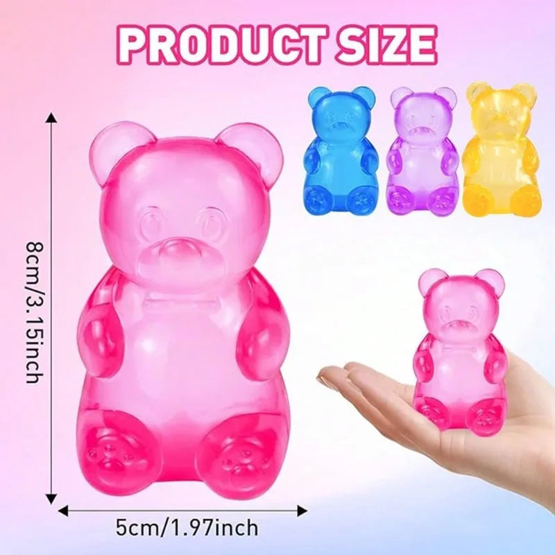 A set of pink and purple gummy bear sensory stress relief fidget toys shown next to a hand for scale.