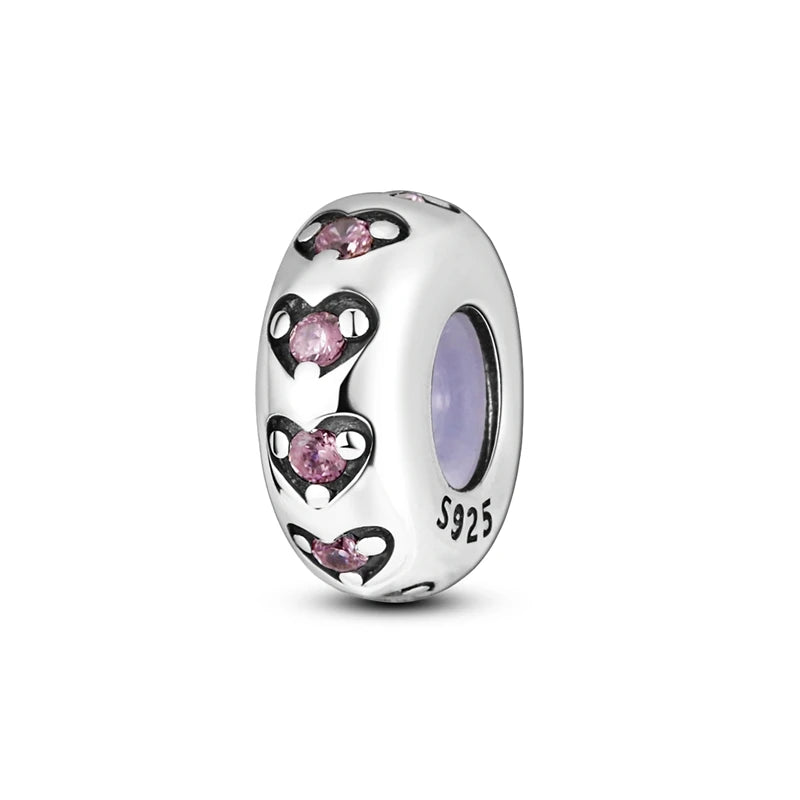 A silver heart charm bead featuring pink zircon stones, set in 925 sterling silver.
