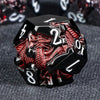 A black and red dragon-themed metal die showing the number 1.