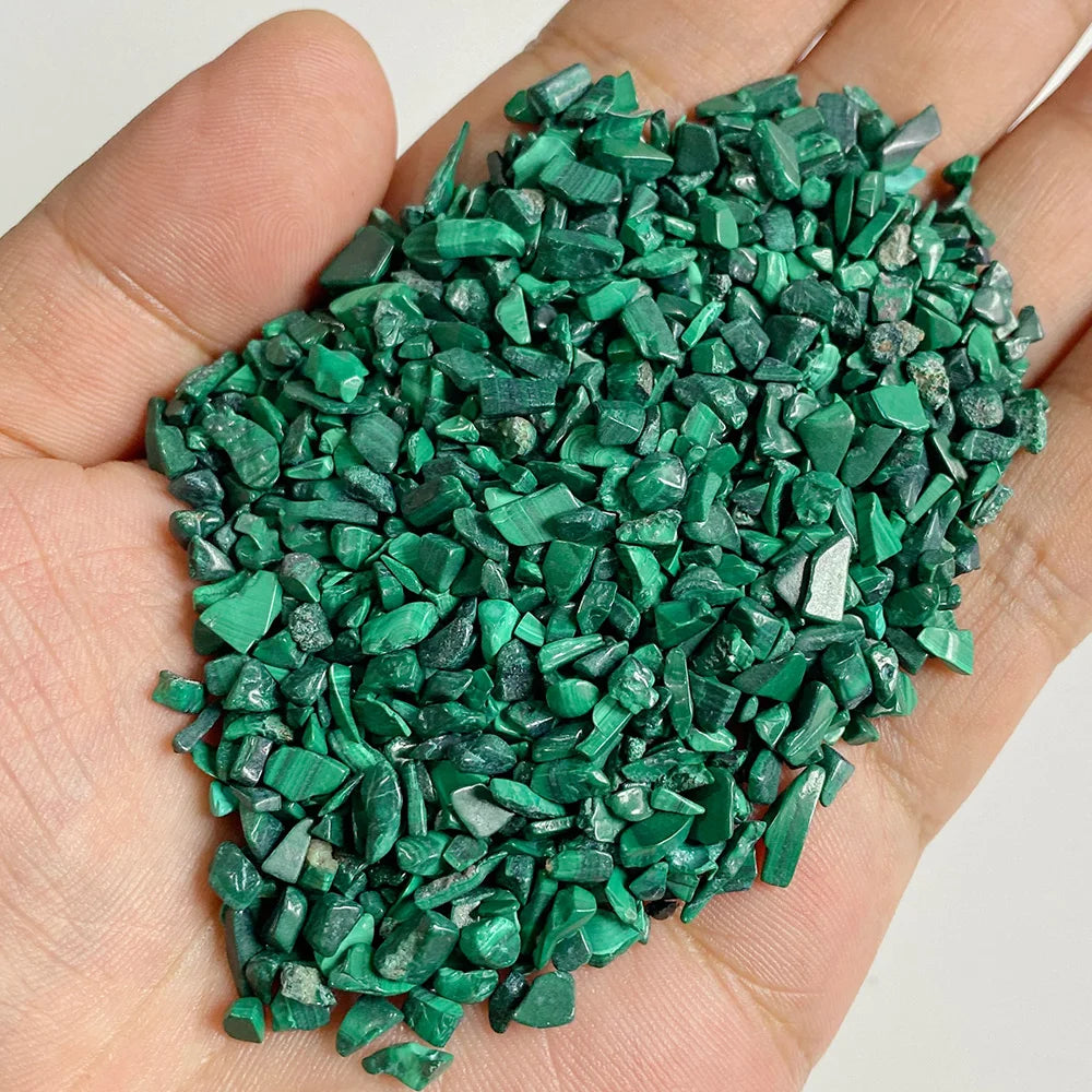 A handful of bright green natural tumbled stone chips for jewelry making and home decor
