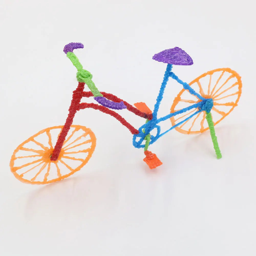 A multi-colored 3D pen bicycle made from filament, featuring red, green, purple, and orange components.