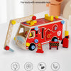 A red fire truck wooden toy with removable nuts and building pieces on a white surface.