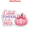 A pink pumpkin with a bow, featuring a heart pattern, used as autumn pumpkin flatback resin décor.