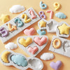 A silicone mold set featuring various shapes like clouds, hearts, and donuts in pastel colors for baking and crafts.