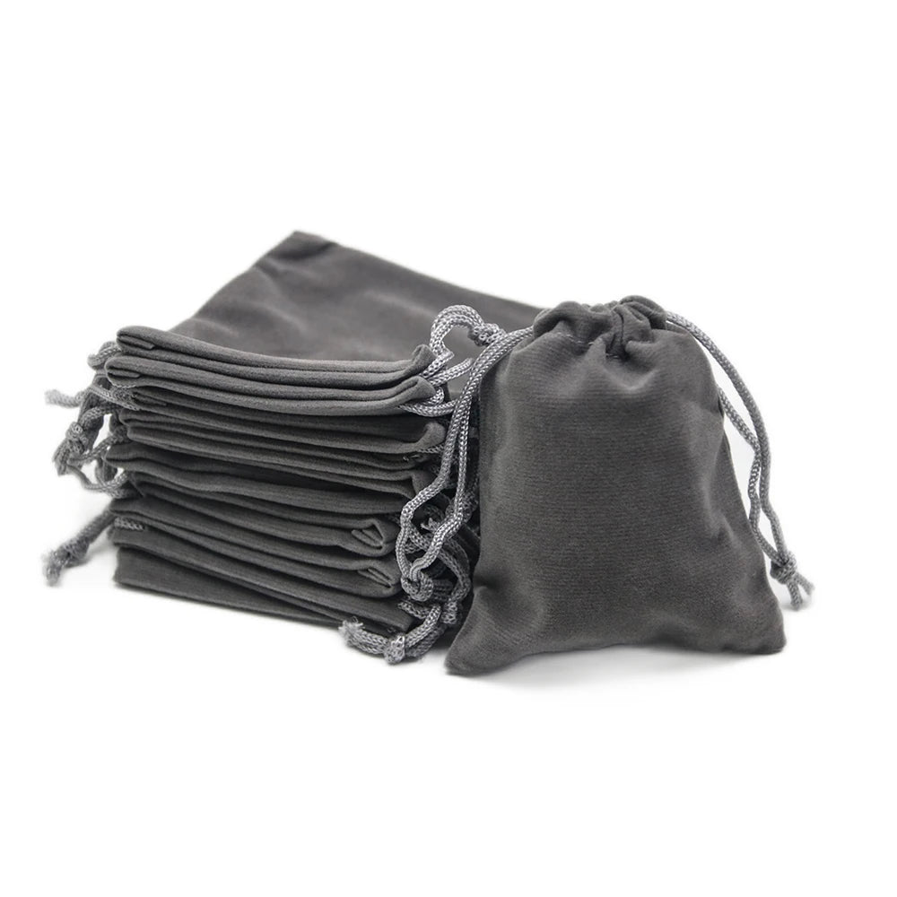 A stack of dark gray drawstring dice bags for tabletop games.
