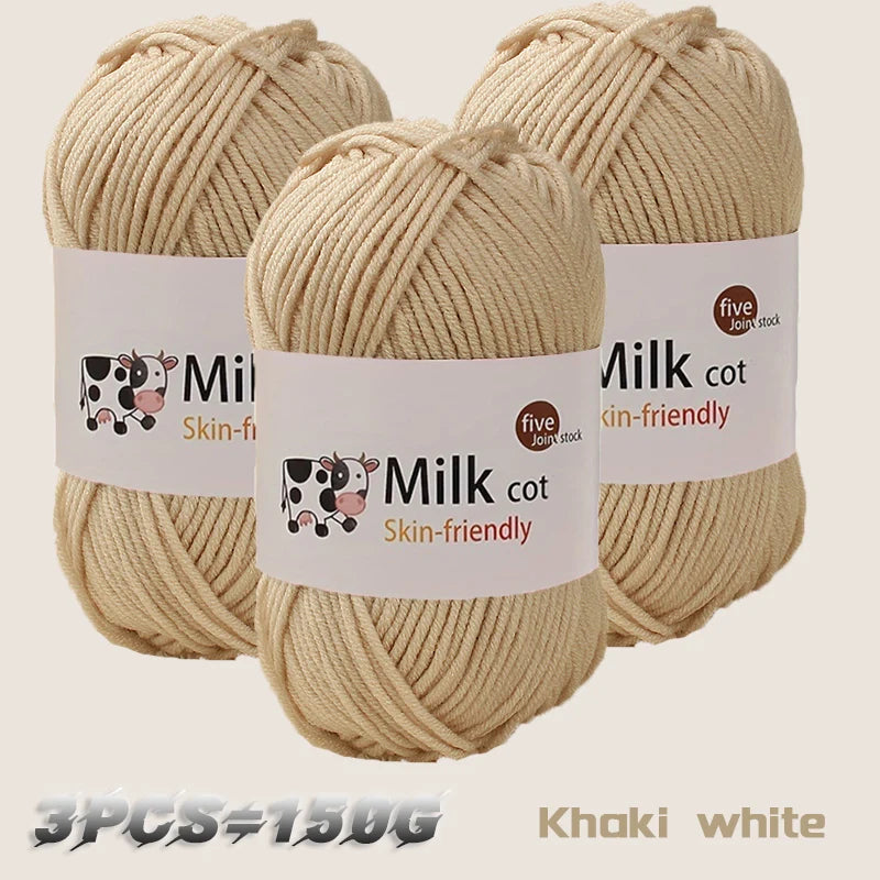 Three skeins of khaki white milk cotton yarn are displayed, showing the texture and labeling.