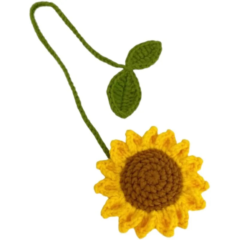 Handmade crochet sunflower charm with a green stem and leaf.