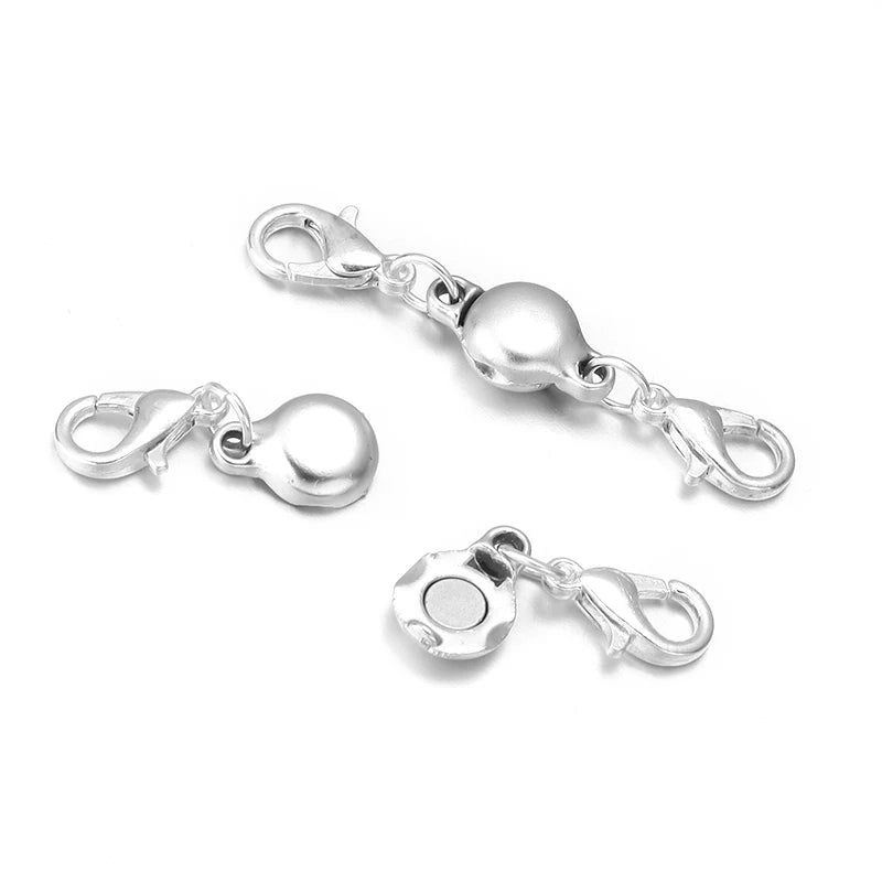 Silver magnetic clasps for jewelry making showing various connector styles.