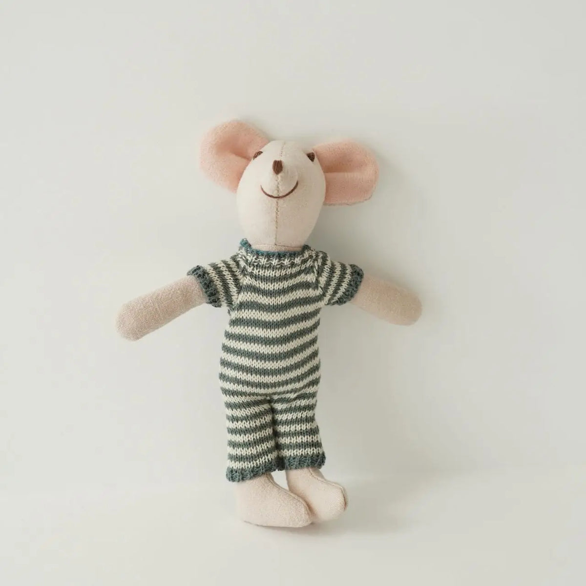 A handmade mouse plush doll with pink ears and a striped green outfit.