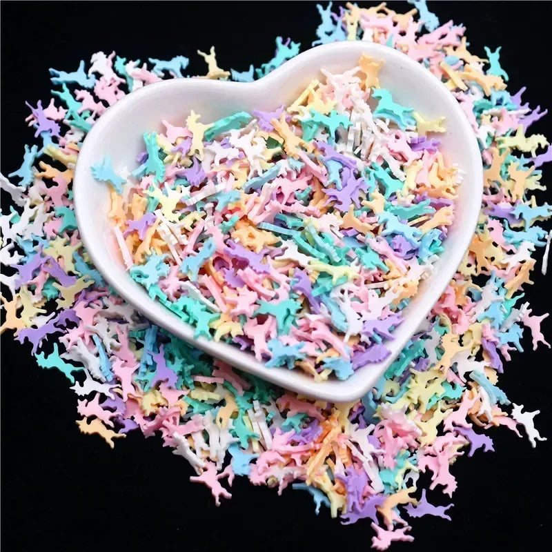A heart-shaped dish filled with colorful polymer clay sprinkles for slime and craft decor