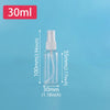 A clear glass refillable travel spray bottle with a fine mist pump, labeled 30ml.