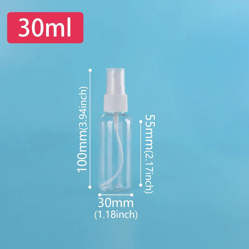 A clear glass refillable travel spray bottle with a fine mist pump, labeled 30ml.