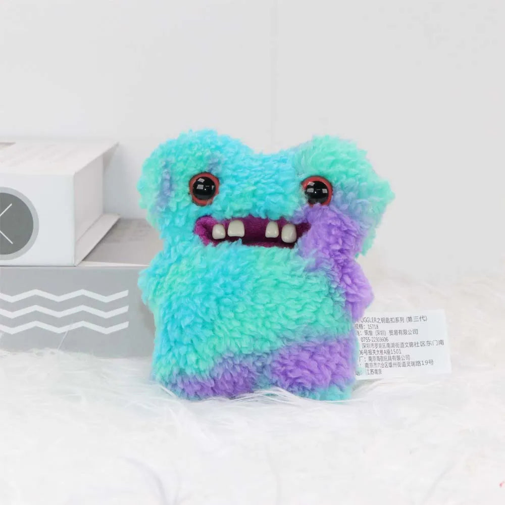 A fluffy, bright blue and purple monster plush toy with large eyes and a toothy grin.