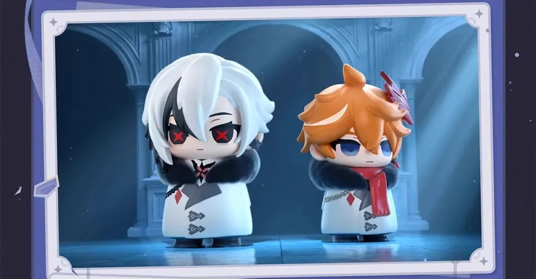 Two chibi figurines of Fatui Harbingers, one white-haired and one orange-haired, displayed in a framed box.