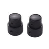 A pair of black dual concentric stacked control knobs for electric guitar and bass.