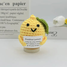 Handwoven crochet pencil ornament shaped like a lemon with green leaves, yellow color.