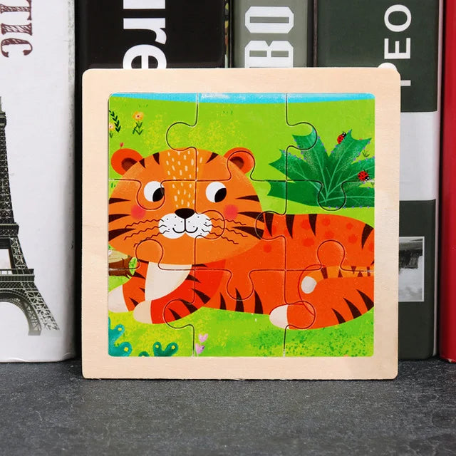 A wooden jigsaw puzzle featuring an orange tiger and green foliage on a light wood background.