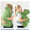 A woman is wearing a green cartoon hooded warm cloak designed like a dinosaur for warmth and comfort.