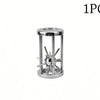 A single stainless steel brain teaser puzzle lock set with a circular top and multiple spiky pins.
