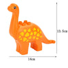 An orange dinosaur-shaped building block toy with yellow spots, shown from the side.